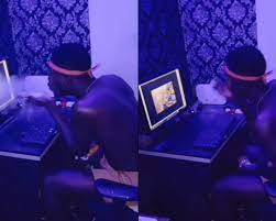 FRAUD BOY Massive Stir As Leaked Video Of Fraud Boy Spotted Performing Rituals On Laptop To Scam White Man Hits Online and Goes Viral -WATCH VIDEO